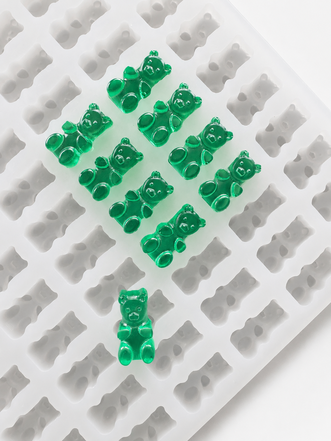 Close-up of finished gummy bears showing the surface condition manufacturers monitor for sweating and stickiness