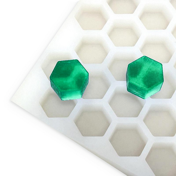 4.9mL hexagon gummy mold with 176 cavities and two emerald green hexagon gummies on a white background