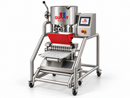 Front-angle view of Gummy Molds automatic 10-nozzle gummy depositor with 25L cooker, red 12L heated hopper and clear silicone gummy mold